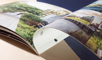 Full color grommet bound real estate booklet