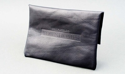 Debossed logo textured leather pouch