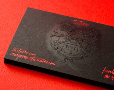 Embossed black paper business card